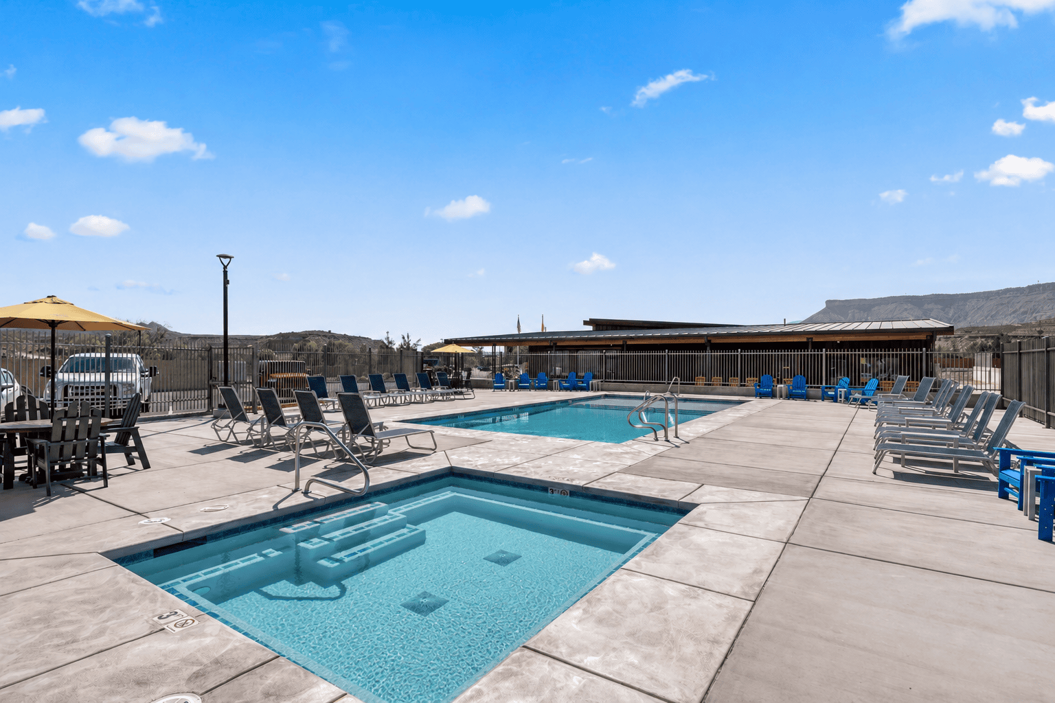 Outdoor pool area with lounge chairs