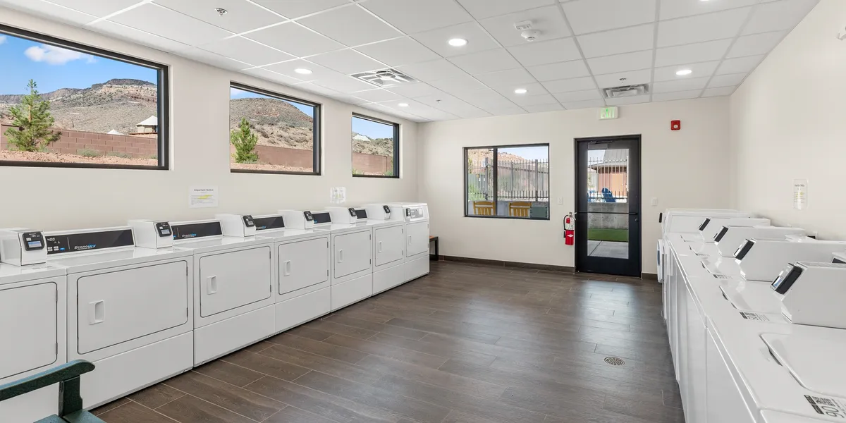 Spacious laundromat interior with dryers